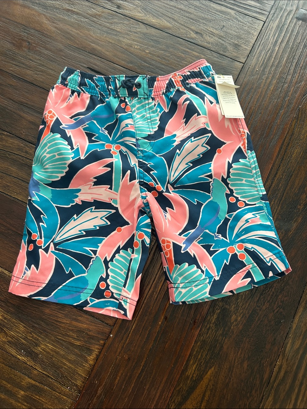 Kids Coral & Teal Tropical Leaf Swim Trunks
